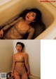 A woman in a bathtub with water on her body.